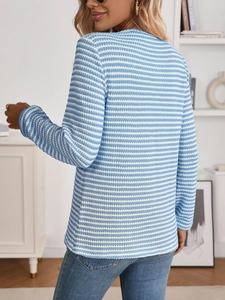 Rear view of long sleeve knit top featuring classic blue and white horizontal stripes