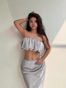 Elegant silver satin two-piece set featuring off-shoulder tube top and slim midi skirt