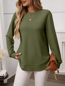 Detail of army green waffle knit long sleeve top with crew neck and curved hemline