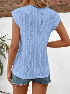 Detail of light blue sleeveless knit top featuring hollow-out diamond pattern on back side