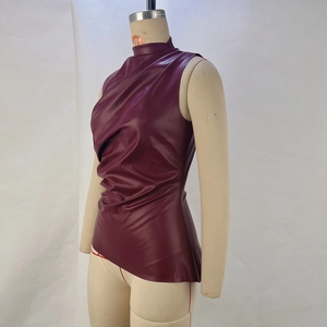 Detail of burgundy PU leather top featuring a high cowl neck and asymmetric hemline