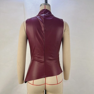 Detailed back view of a burgundy faux leather top featuring a metal zipper and irregular hem
