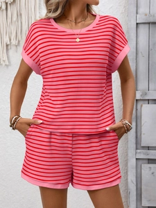 Detail of red and pink striped knit two-piece summer set with elastic waist shorts