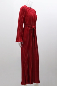 Detail of dark red pleated maxi dress with high elastic fabric and waist tie