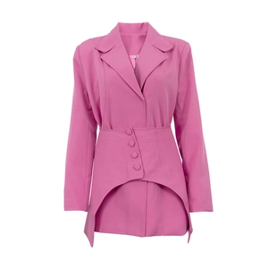 Detail of pink blazer featuring notched lapels and unique irregular fishtail hem design