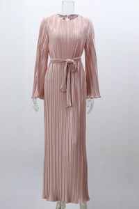 Detail of pink pleated maxi dress showing shimmering satin fabric and waist tie belt