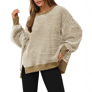 Oversized white and brown striped crewneck knit sweater with side slits and high-low hem