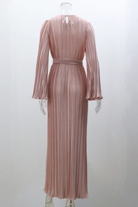 Detail of rose gold pleated maxi dress showing waist tie and fine accordion texture