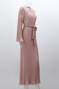 Detail of dusty pink pleated maxi dress showing side profile with waist tie and texture