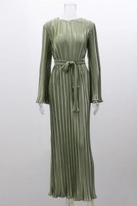 Detailed close-up of sage green pleated dress fabric texture with elastic waist tie