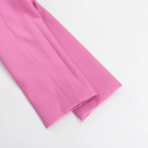 Macro detail of the cuff and fine stitching on this pink blazer two-piece set for women