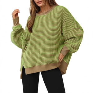 Oversized green and brown striped knit sweater with crew neck and ribbed cuffs for women