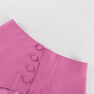 Detail of rose pink high waist skirt with diagonal lapel and matching fabric buttons