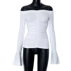 Detailed view of white off-shoulder top with center ruching and elegant flare sleeves