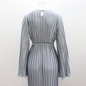 Rear view of pleated silver dress showing water-drop back button and fabric texture
