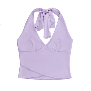 Detail of lavender halter top featuring deep V-neck and elegant wrap-around hem design