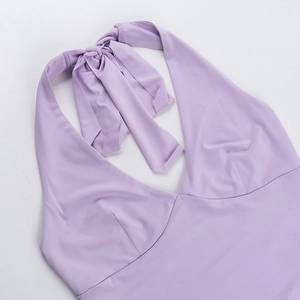 Macro detail of lavender halter top showing deep V-neck and fine fabric texture