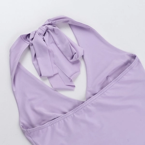 Detail of light purple backless halter top showing deep V-neckline and tie-up design