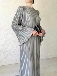 Elegant light gray high neck pleated maxi dress with flared sleeves for a chic autumn look
