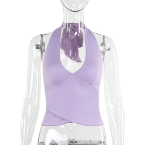 Detail of light purple halter crop top with crossover hem and v-neckline on display