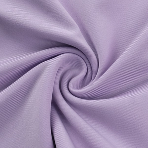 Detailed macro view of the light purple ribbed knit fabric with soft elastic texture
