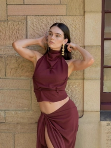 Deep burgundy halter neck backless crop top and high slit wrap skirt set for women