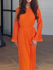 Elegant bright orange pleated maxi dress with long sleeves and a slim waist for women