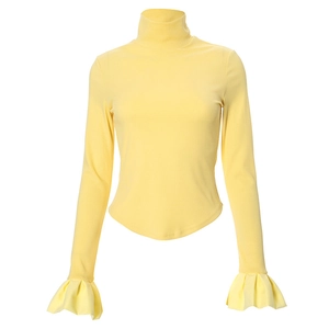 Detailed view of the ribbed fabric texture and flared ruffle cuffs on yellow top