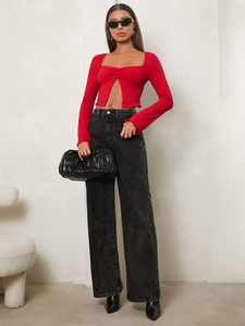 Women's red long sleeve crop top with square neck and distressed denim jeans