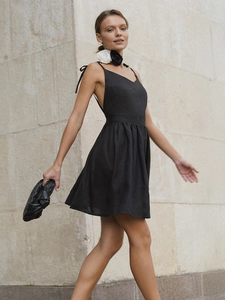 Elegant black cotton backless mini dress with spaghetti straps and floral choker