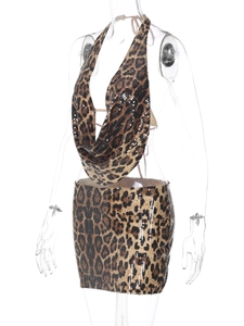 Detail of leopard print sequin two-piece set featuring a deep V halter top and mini skirt