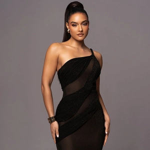 Detail of black one-shoulder dress with sheer mesh paneling and shimmering fabric