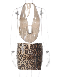 Back view of leopard print sequin two-piece set featuring halter top and mini skirt