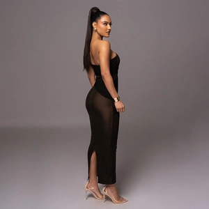 Close-up of black shimmering dress with side sheer mesh panel and slit detail