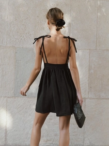 Elegant black backless cotton mini dress with tie straps and high waist for summer fashion