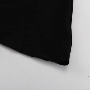 Detailed close-up of the professional hem stitching on this black A-line French dress