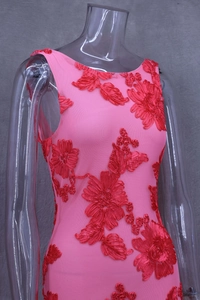 Close-up of intricate 3D red floral embroidery on pink mesh sleeveless dress