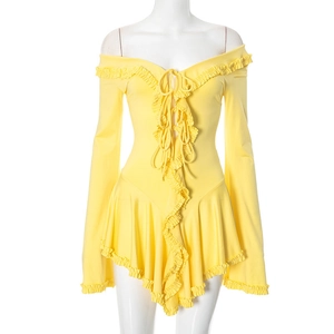 Detail of yellow off-shoulder dress featuring drawstring front and ruffled edges