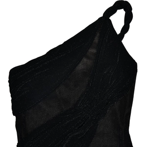 Detail of black one-shoulder mesh top with twisted strap and ruched glitter fabric