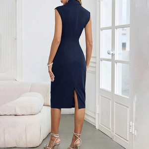 Close-up of dark blue sleeveless dress featuring a high collar and elegant back slit