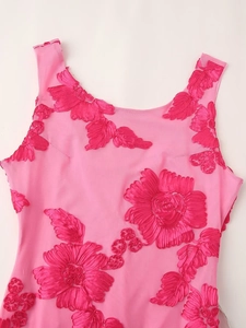 Detail of pink sleeveless dress showing 3D floral embroidery on sheer mesh fabric