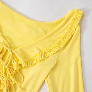 Detail of yellow dress showing ruffle trim edge and adjustable lace-up drawstrings