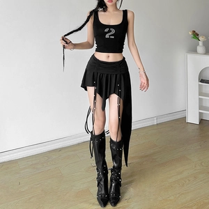 Detail view of black irregular skirt with pleated waist and long decorative beaded ribbons