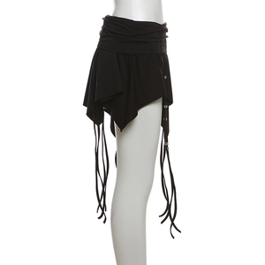 Detail of black irregular mini skirt featuring side ruching and long tasseled metal beads