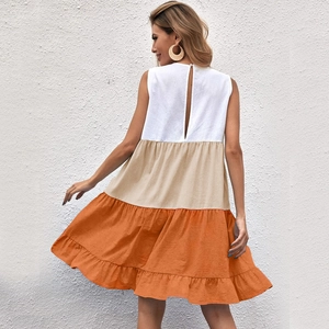 Detail view of the keyhole back closure and tiered ruffle hem on a sleeveless summer dress