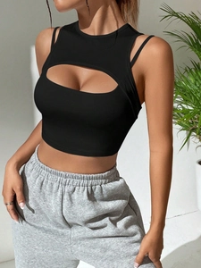 Detailed close-up of a black hollow-out cropped vest with double shoulder straps and round neck