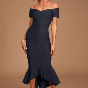 Close-up of elegant off-shoulder fishtail dress with layered ruffle hem and slim fit design