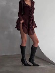 Elegant wine red V-neck ruffle dress with flare sleeves and black pointed knee-high boots