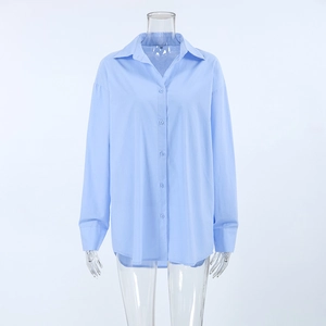 Detailed view of the classic lapel and button closure on this light blue cotton linen shirt