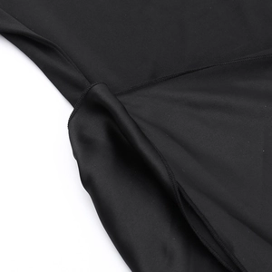 Detail view of flatlock seams and mesh fabric texture on this elegant black dress
